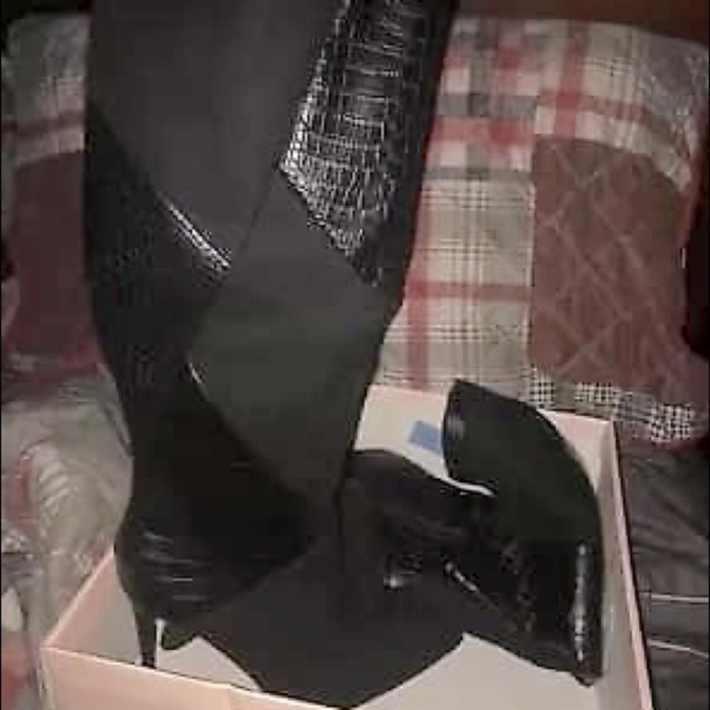 Black knee high heeled boots